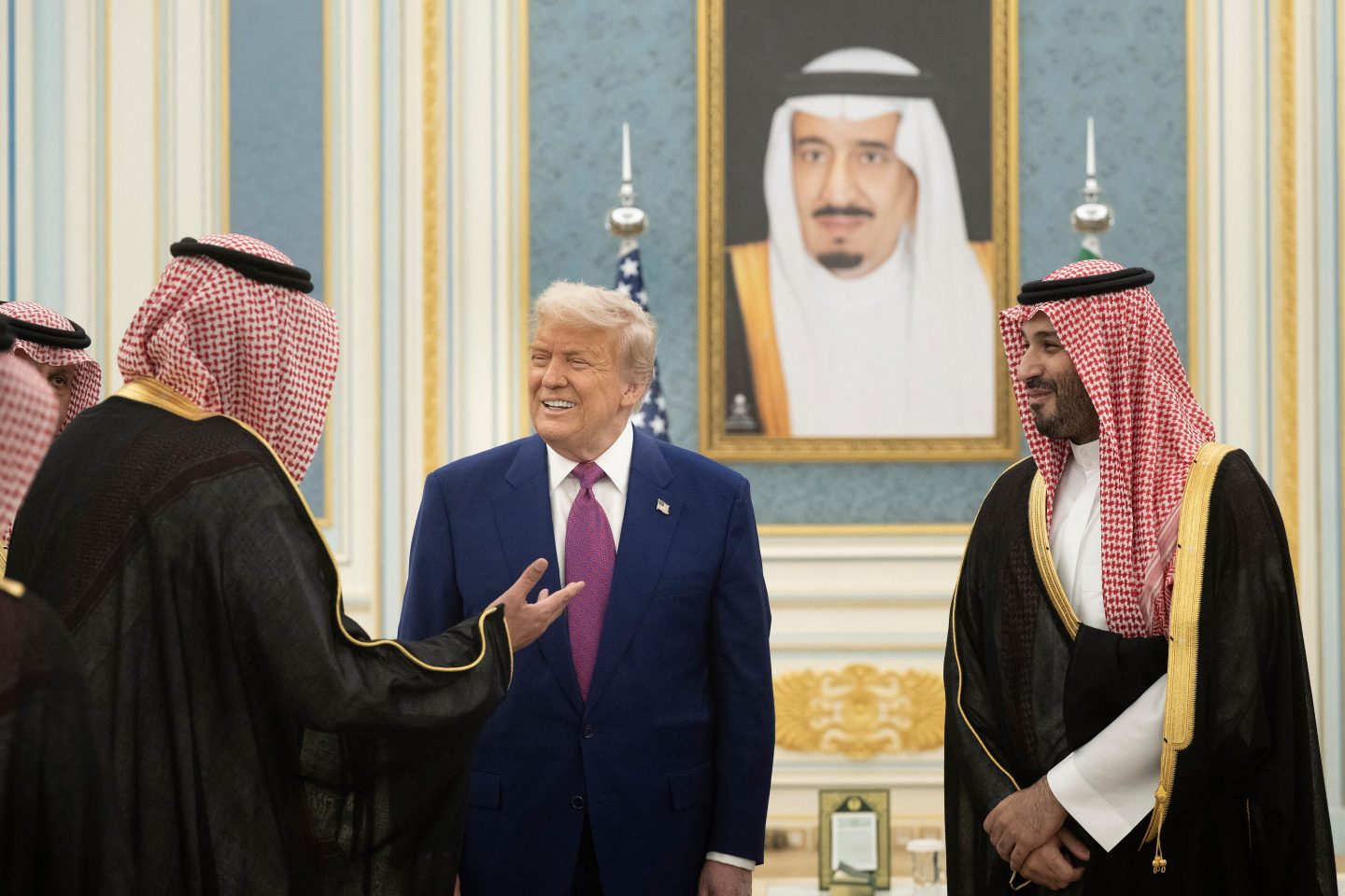 Saudi Crown Prince Mohammed Bin Salman (R) and US President Donald Trump greet delegation members at the Royal Court in Riyadh on May 13, 2025. (Photo by Brendan Smialowski / AFP) (Photo by BRENDAN SMIALOWSKI/AFP via Getty Images)