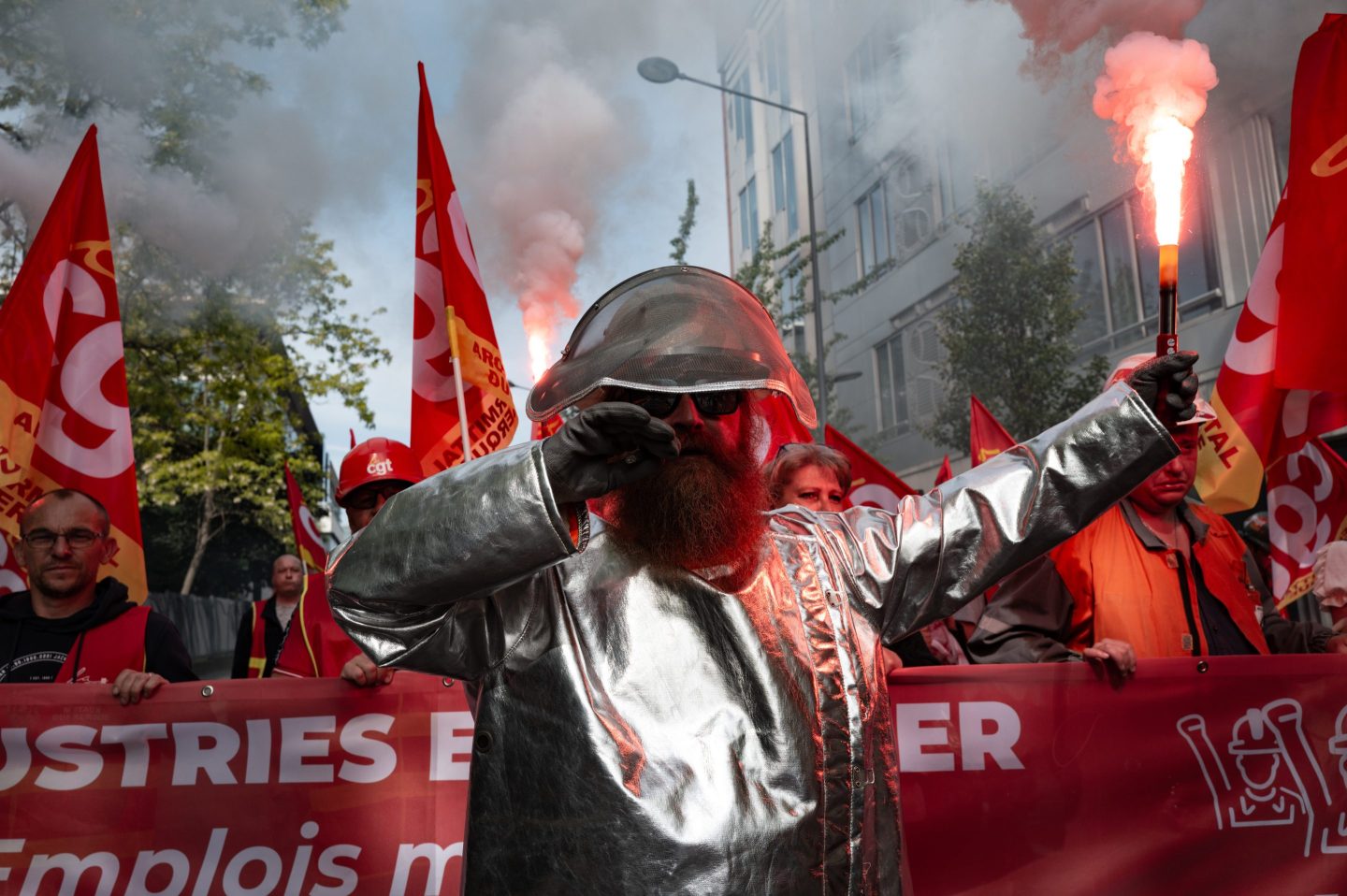 CGT unionists and employees participate in a rally outside ArcelorMittal headquarters to put pressure on the French management of the steelmaker, which plans to cut more than 600 jobs in Saint-Denis near Paris, on May 13, 2025. (Photo by Jerome Gilles/NurPhoto via Getty Images)